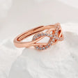 The opening is adjustable. / Rose gold