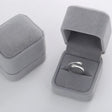 The opening is adjustable. / silver ring with a box